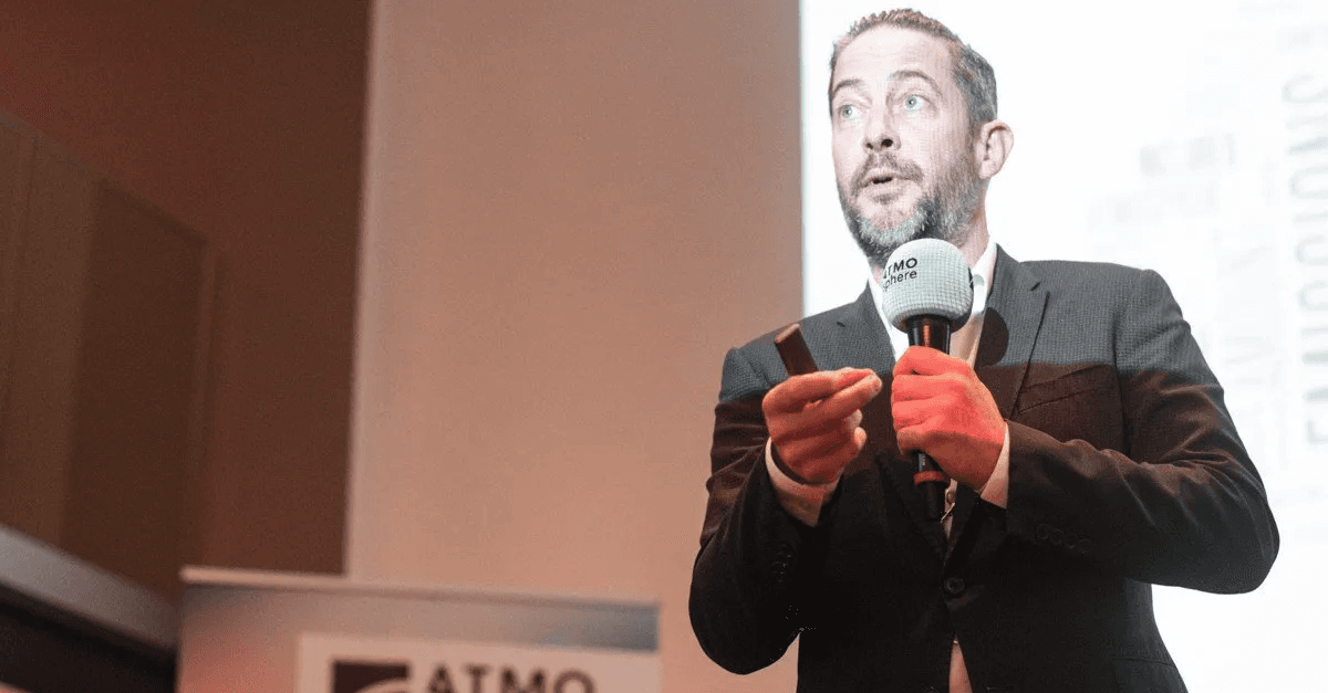 David Schalenbourg presenting about Delhaize's new HVAC&R technologies at ATMO Conference, networking event about natural refrigerants